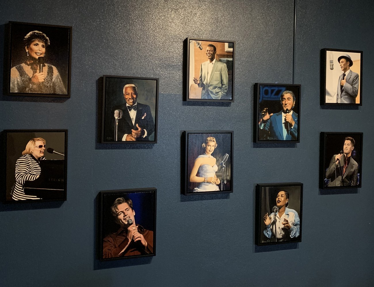 Diana Jelen's framed jazz vocalist portraits on the museum wall